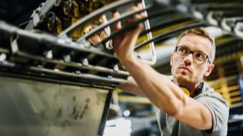 Post-Sales Logistics Man working on industrial machine