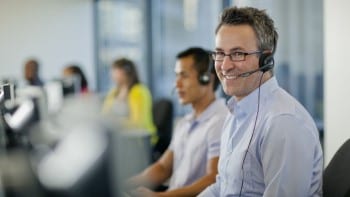 Transportation Management Man in call center with headset