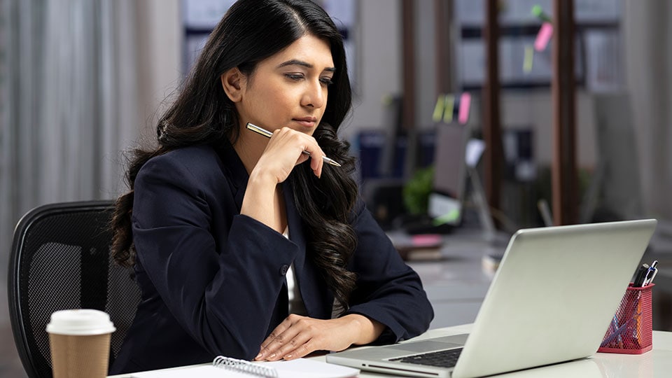 Woman researching on her laptop. Woman researching on her laptop.