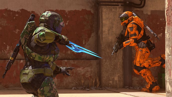 Two Spartans &mdash; one in green, one in orange armour &mdash; face off against each other in Halo Infinite multiplayer.