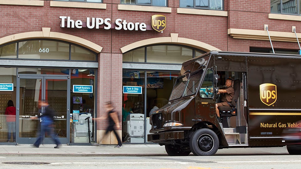 UPS driver dropping off package UPS driver dropping off package