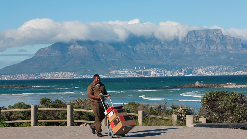UPS driver with delivery on cart UPS driver with delivery on cart
